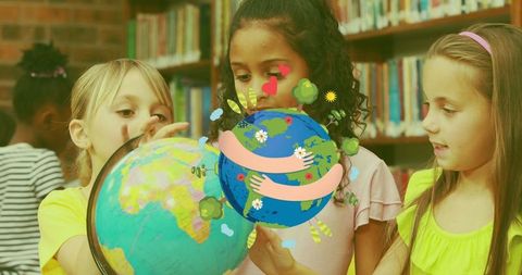 Multicultural Schoolgirls Exploring Globe Icon on Earth's Surface
