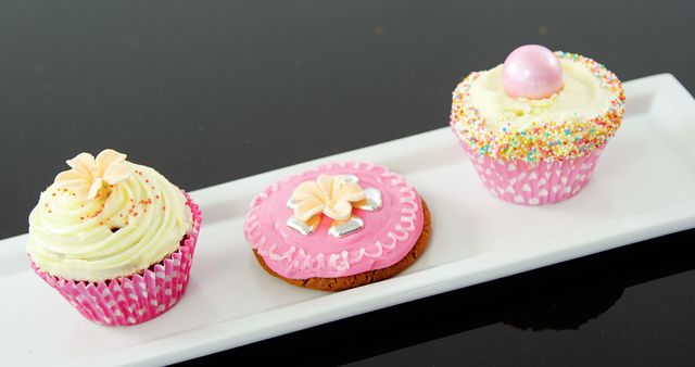Assorted Pink and White Decorated Cupcakes and Cookie on White Tray - Download Free Stock Images Pikwizard.com