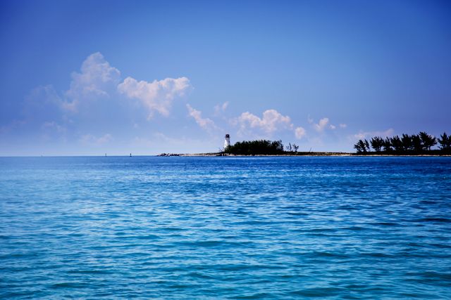 Serene Tropical Island Horizon Over Crystal Clear Ocean - Download Free Stock Photos Pikwizard.com
