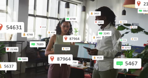 Diverse Coworkers Analyzing Digital Notifications in Modern Office