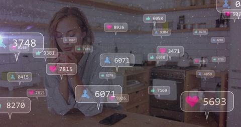 Influencer analyzing social media engagement in modern kitchen