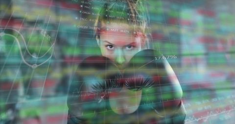 Female boxer training with stock market overlay showing focus strength and strategic drive