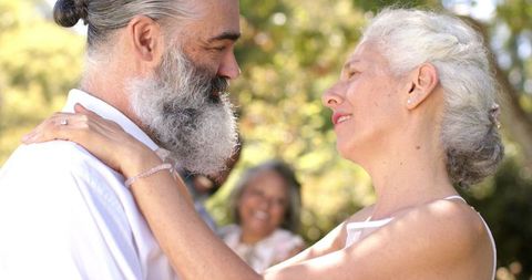 Senior Couple Dancing at Outdoor Wedding Celebration
