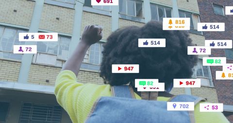 Social Media Engagement: Young Woman Raising Fist in Urban Background