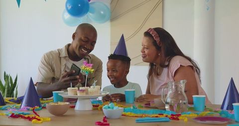 Diverse Family Joyfully Celebrating Birthday at Home Together
