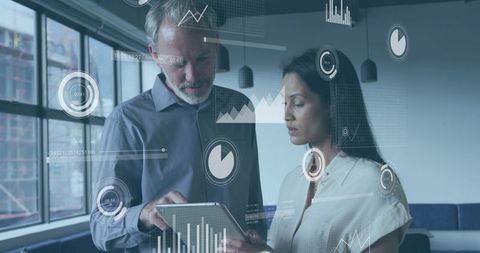 Colleagues Reviewing Tablet with Interactive Data Overlays for Business Analytics