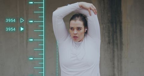 Plus size woman exercising in urban environment