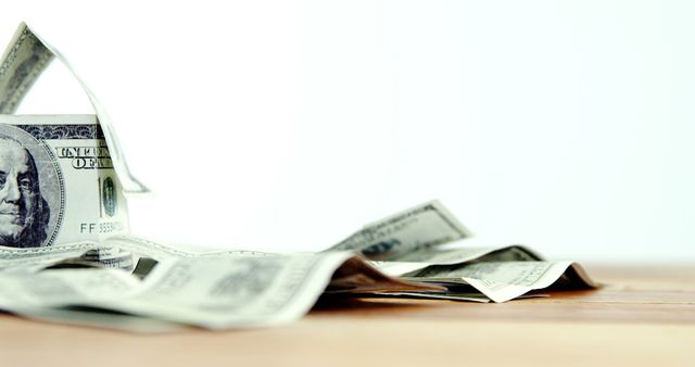 Close-up of dollar bank notes scattered on the table against white background 4k