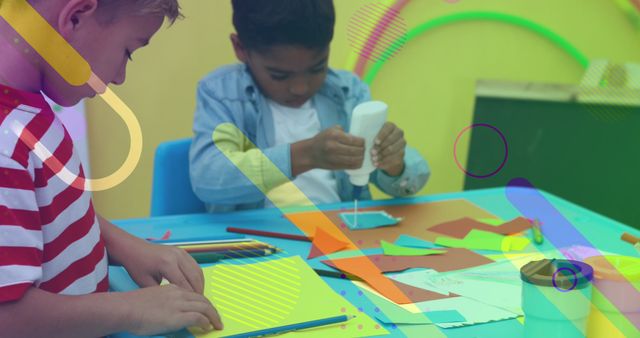 Two young children working on art projects using glue and colored paper, suitable for educational content emphasizing creativity and hands-on learning activities. Ideal for school campaigns, art programs, educational blogs, and promotional materials for children's crafting events.