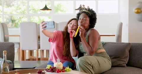 Lesbian Couple Celebrating Birthday with Selfie and Snacks