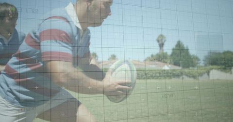 Rugby Player Driving Forward Holding Rugby Ball in Action