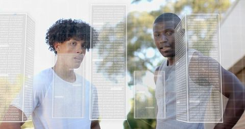 Young Duo Analyzing Data with Binary Augmented Reality Overlays Outdoors, Tech Collaboration