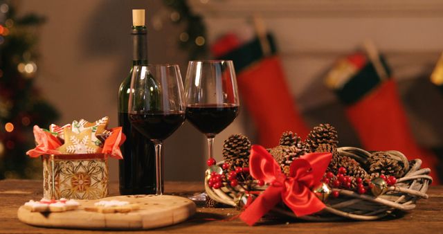 Red wine bottle with glass and pine cone on wooden table 4k