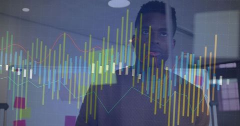 Businessman analyzing digital charts in modern office setting