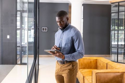 Business Professional Working with Tablet in Modern Office Environment