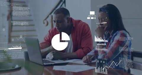 Collaborating on business analytics using laptop with holographic charts and graphs