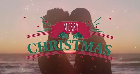 Romantic Christmas Beach Sunset with Couple Silhouette and Festive Greeting