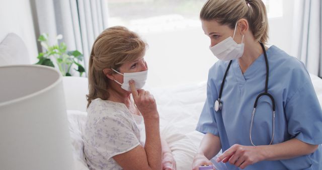 Healthcare Professional Supporting Senior Patient with Mask - Download Free Stock Images Pikwizard.com