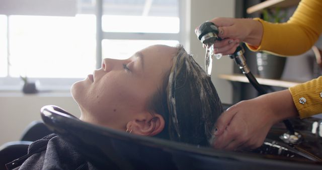 Woman Receiving Hair Wash at Beauty Salon - Download Free Stock Images Pikwizard.com