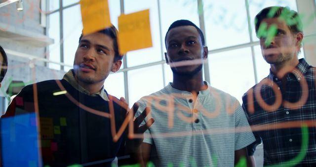 Multi-Ethnic Team Collaborating on Project Board with Sticky Notes - Download Free Stock Images Pikwizard.com