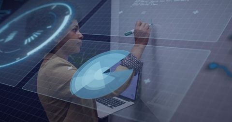 Engineer writing on whiteboard with futuristic hud analytics overlay and laptop workspace