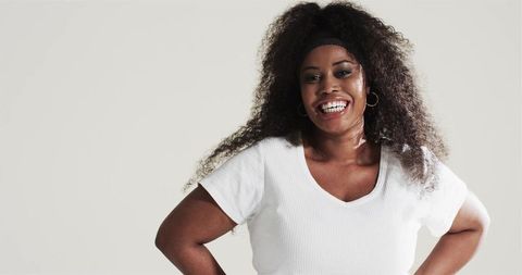 Confident African American Woman with Chic Style in Studio