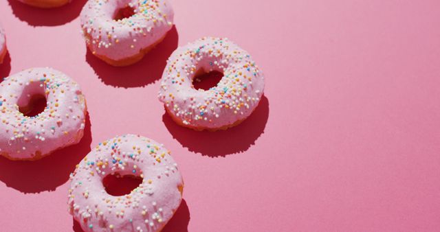 Pink Sprinkled Donuts on Pastel Background - Download Free Stock Photos Pikwizard.com