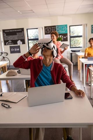 Students Engaging in Virtual Reality Learning Experience in Classroom