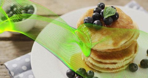 Stack of Fluffy Pancakes with Blueberries and Fresh Mint