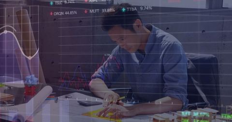 Businessman Analyzing Finances Overlay with Digital Charts