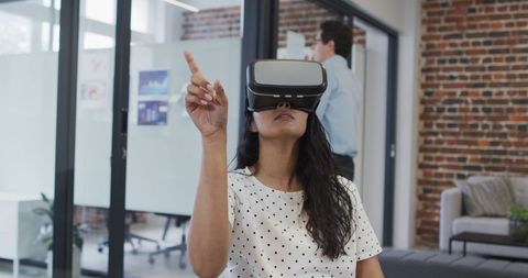 Businesswoman Engaged in Virtual Reality Office Application