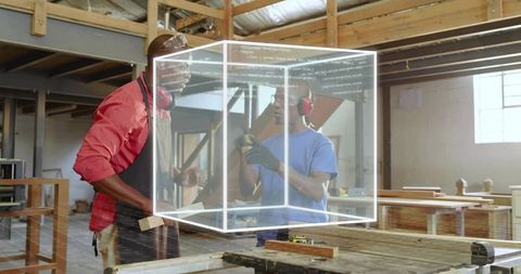 Carpenters exploring holographic 3d design cube while collaborating on woodworking project