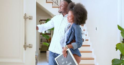 Excited parents capturing first school day moment