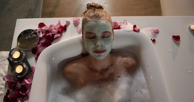 Woman Relaxing in Bubble Bath with Face Mask and Petal Decoration - Download Free Stock Images Pikwizard.com