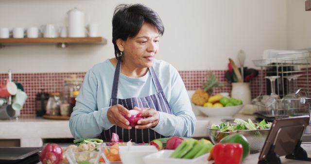 Senior Woman Cooking and Watching Online Recipe in Modern Kitchen - Download Free Stock Images Pikwizard.com