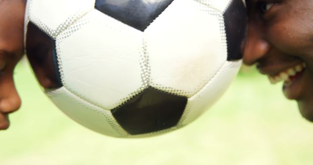 Father and Son Headbutting Soccer Ball Outdoors - Download Free Stock Images Pikwizard.com