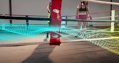 Female boxers sparring in gym ring with teal motion wave overlay
