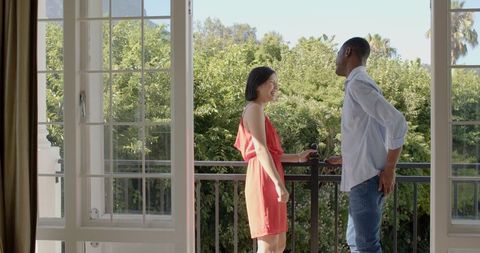 Romantic Proposal on Scenic Balcony