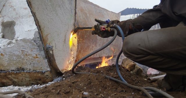 Welder Cutting Metal in Scrap Yard for Waste Management - Download Free Stock Images Pikwizard.com