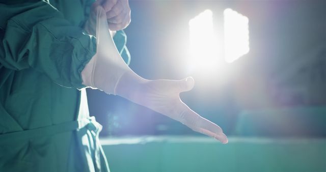 Surgeon Preparing for Surgery Wearing Sterile Gloves in Operating Room - Download Free Stock Images Pikwizard.com