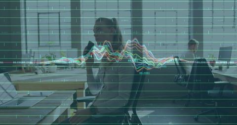 Businesswoman Utilizing Technology with Data Overlay at Modern Office