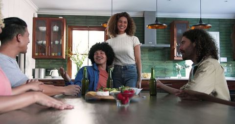 Diverse Friends Celebrating Together in Modern Kitchen
