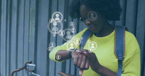 Woman in Yellow Sweater Uses Smartwatch with Social Icons Overlay