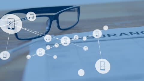 Glasses on Desk with Digital Graph and Connectivity Symbols