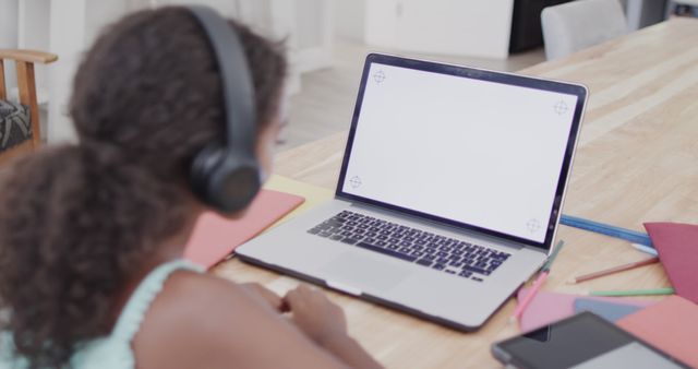 Girl With Headphones Using Laptop for Online Learning at Home - Download Free Stock Images Pikwizard.com