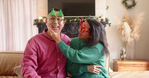 Joyful Couple Celebrating Holidays in Festive Living Room