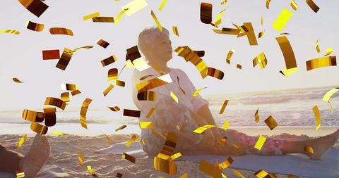 Joyful Senior Couple Enjoying Beach Celebration