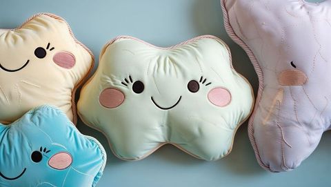 Pastel plush cloud and star pillows with friendly faces