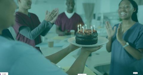 Medical Team Celebrating Birthday with Chocolate Cake in Hospital Lounge