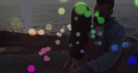 Romantic Couple Embracing by Seaside with Artistic Overlay